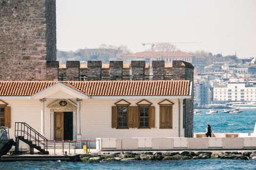 Scenic view of Maiden's Tower with Istanbul in the background, showcasing historic architecture.
