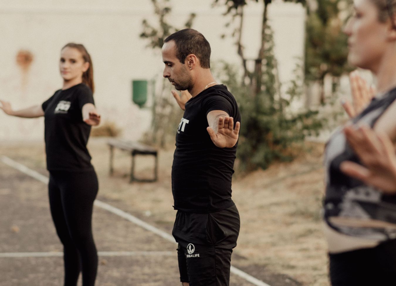 A diverse group of participants engaging in a fitness event outdoors