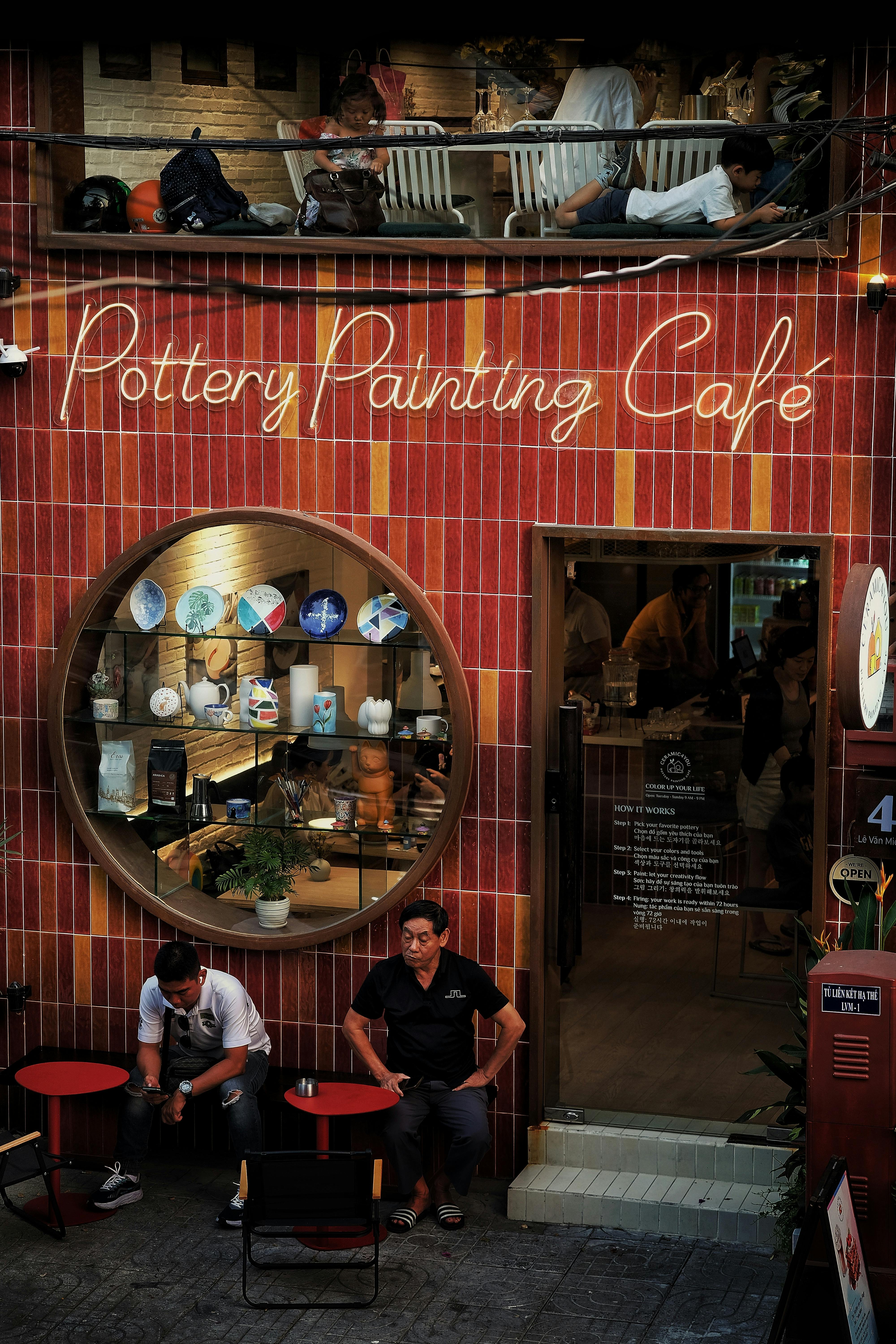 Trendy pottery painting café exterior with inviting decor and ambiance.