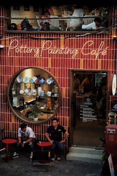 Trendy pottery painting café exterior with inviting decor and ambiance.