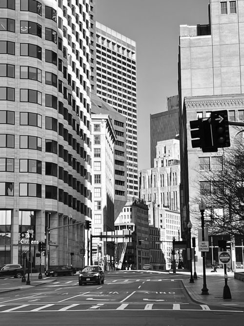 Free Monochrome urban street scene with towering skyscrapers under daylight. Stock Photo