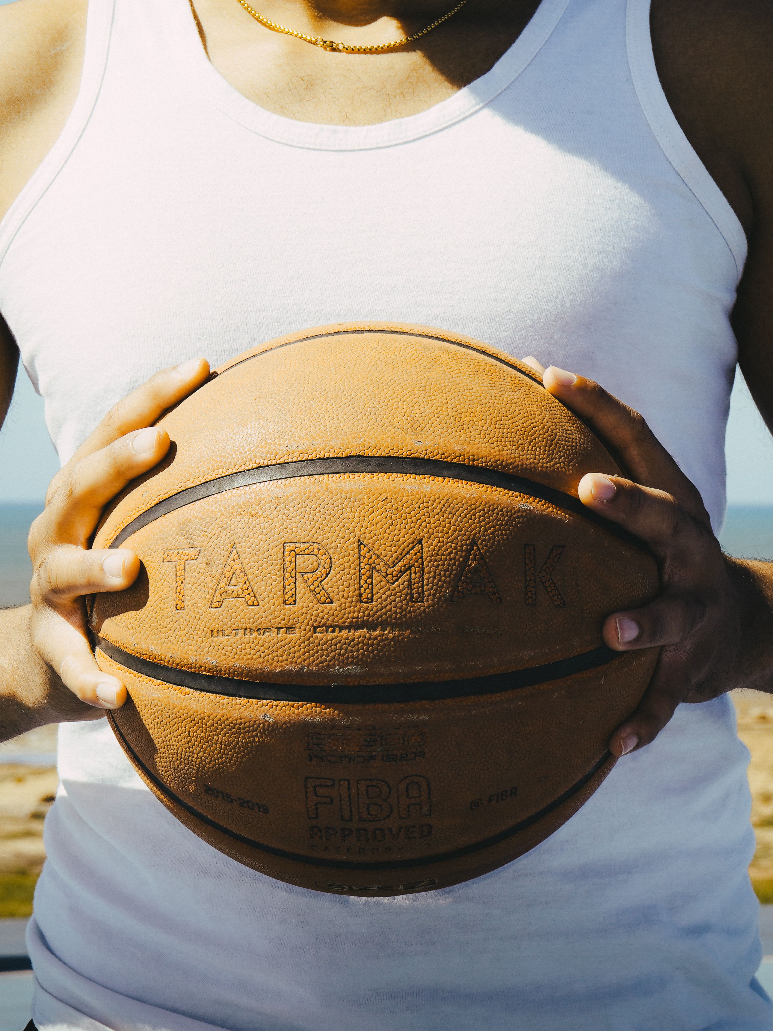 Close-Up of Basketball Held Outdoors in Morocco · Free Stock Photo