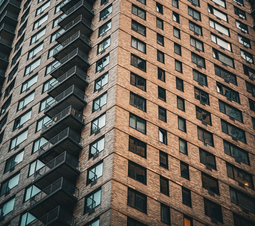 Brick High Rises Towering Urban High-Rise Building in New York City · Free Stock Photo