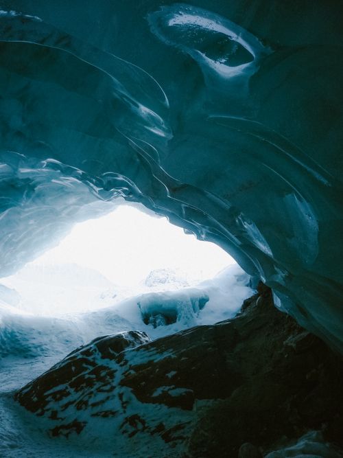 Free Explore the stunning icy formations and textures inside a magnificent ice cave. Stock Photo