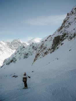 Skier on a snowy mountain slope, perfect for winter sports enthusiasts.