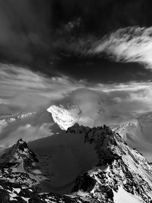 Free Majestic black and white mountain landscape under dramatic sky. Stock Photo