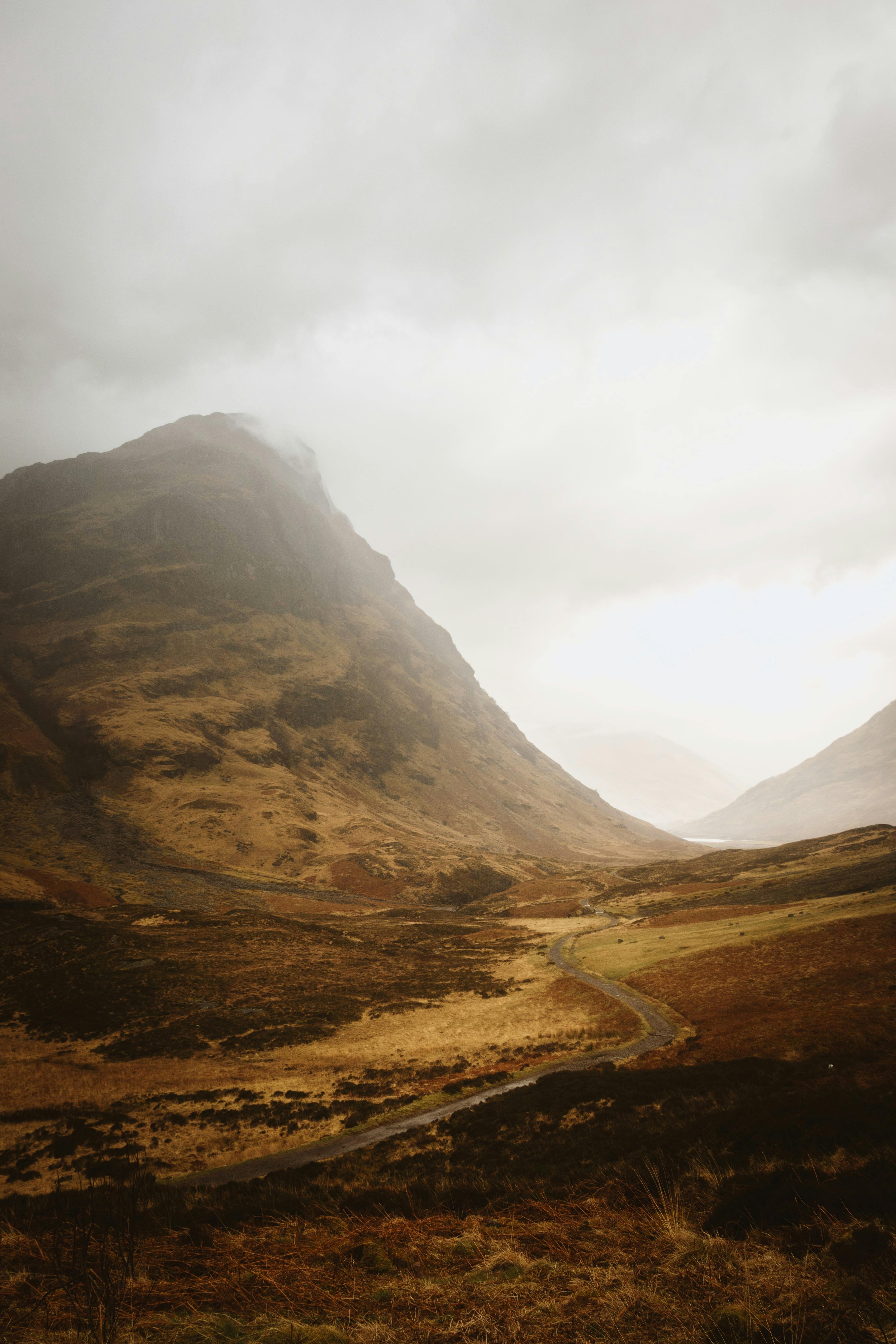 Breathtaking misty view of the Three Sisters in Glencoe, Scotland.