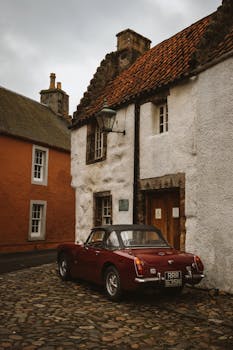 Classic car parked in the charming historical town of Culross, Scotland.