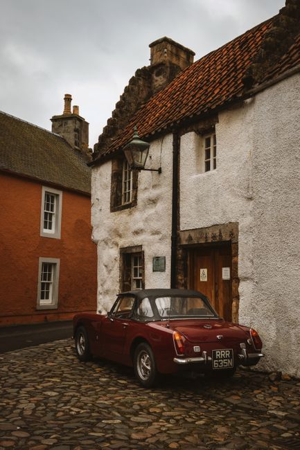Classic car parked in the charming historical town of Culross, Scotland.