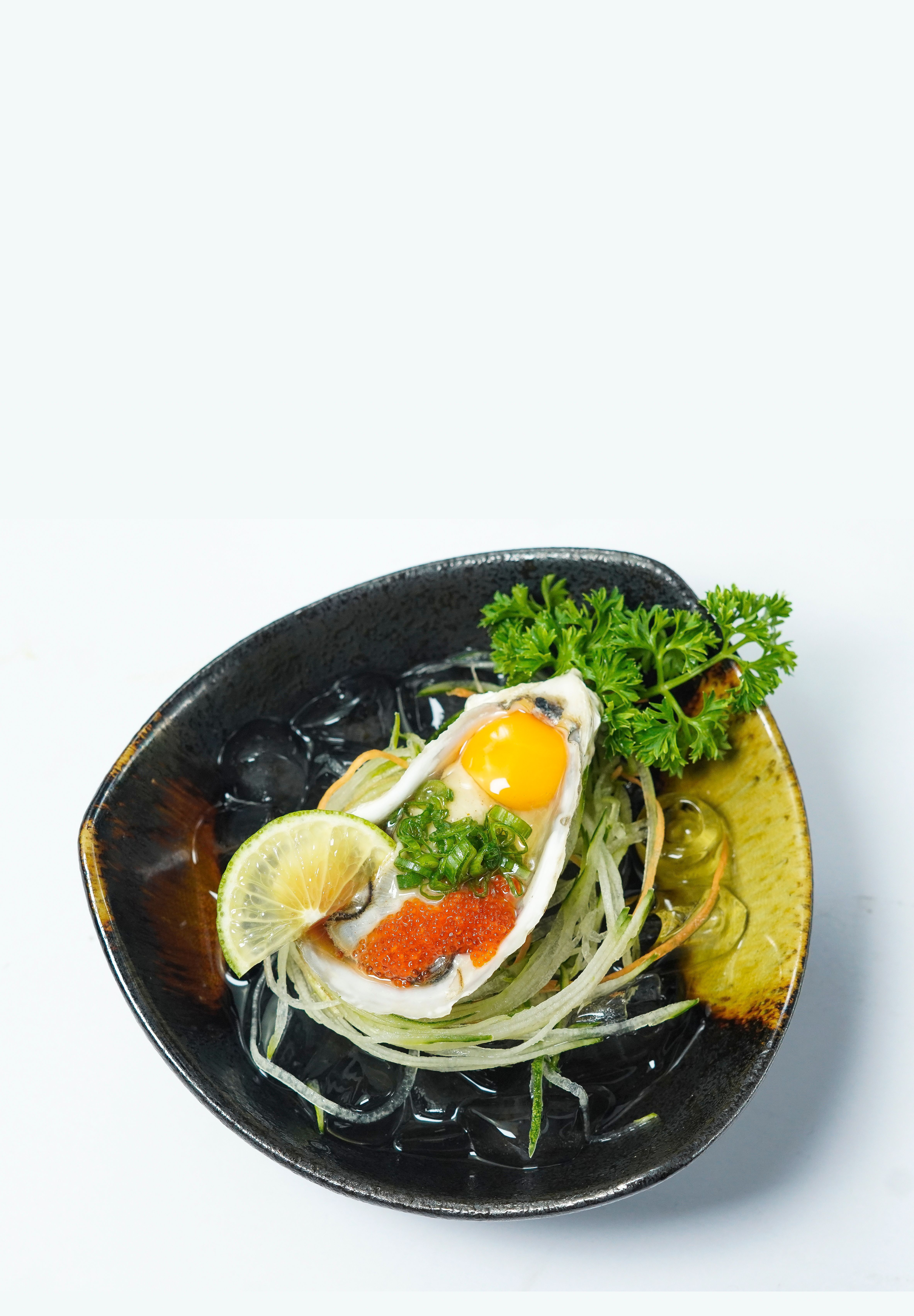Fresh Vietnamese seafood dish served on ice with garnish, featuring vibrant ingredients.