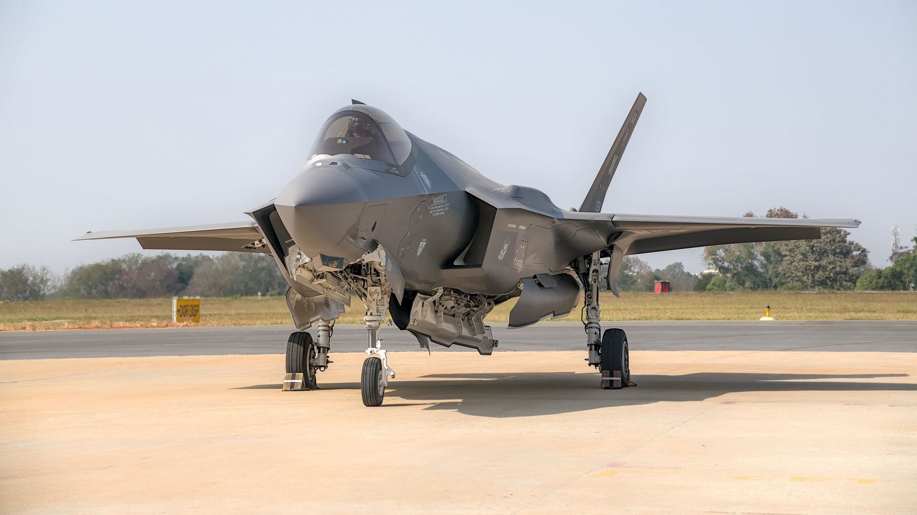 A state-of-the-art fighter jet parked on an airstrip in Bengaluru, India.