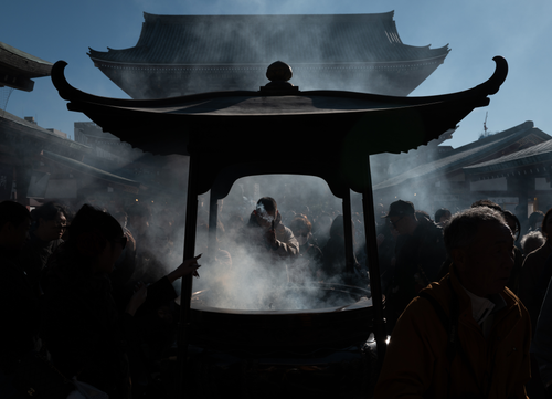 Free Silhouettes of people in smoky incense burners at Sensoji Temple, Tokyo, Japan. Stock Photo