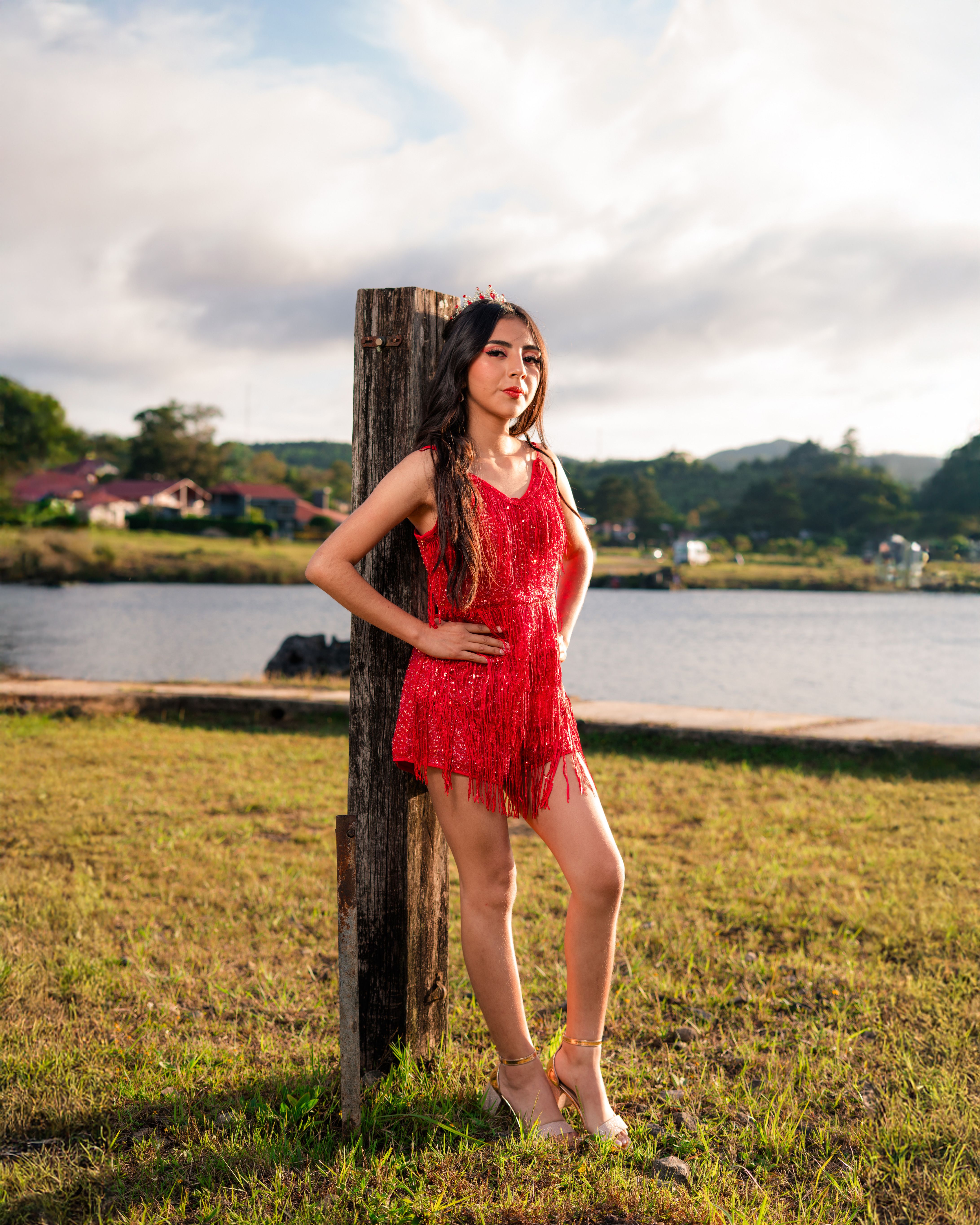 Young Woman in Red Dress by a Lakeside Landscape · Free Stock Photo