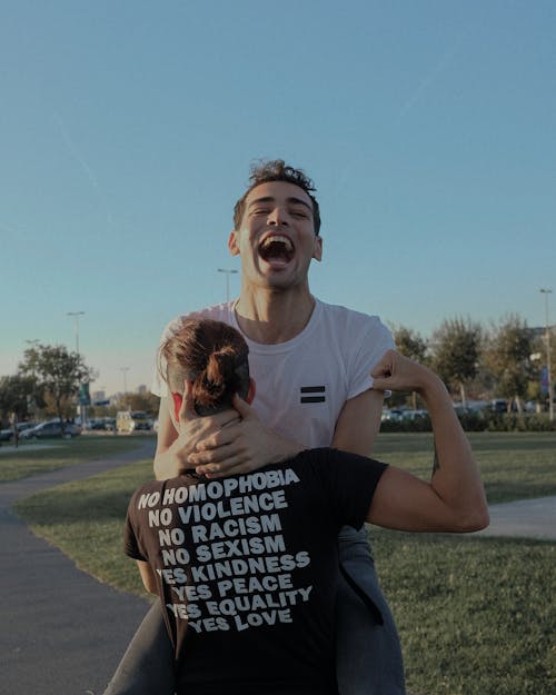 Free Photo of Man Carrying Another Man Stock Photo