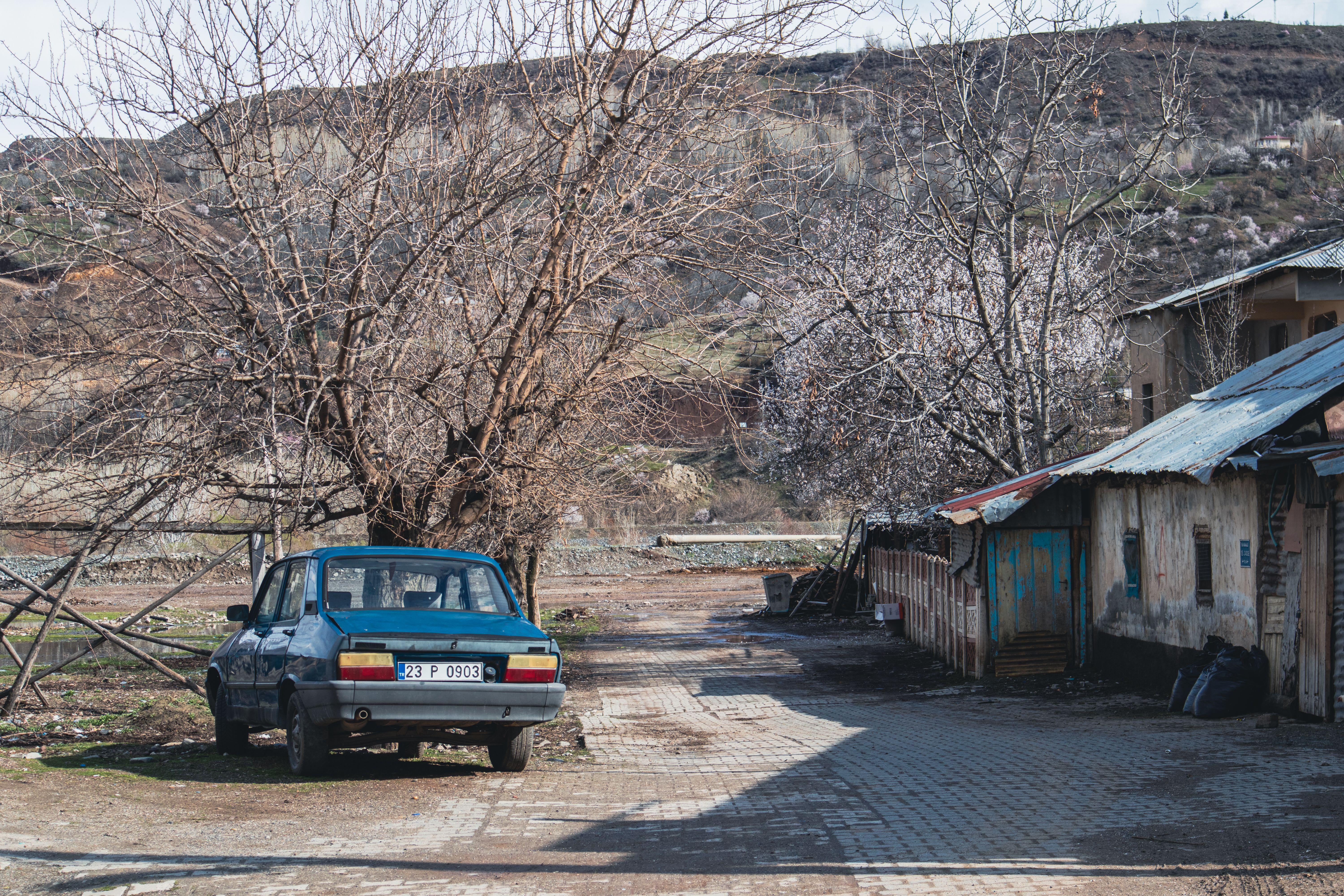 Vintage Car in Rural Palu, Türkiye Street Scene · Free Stock Photo