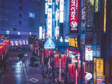 Explore the lively nightlife of Shinjuku, Tokyo surrounded by neon lights and bustling crowds.