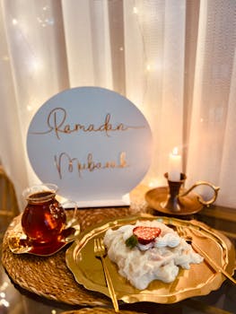 A beautifully arranged dessert and tea setup celebrating Ramadan with a warm ambiance.