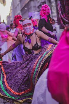 Vibrant street parade showcasing dancers in colorful costumes celebrating cultural festivities.