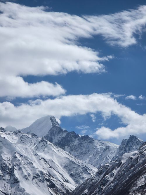 Free Stunning view of the snow-capped Himalayan mountains under a bright blue sky. Stock Photo