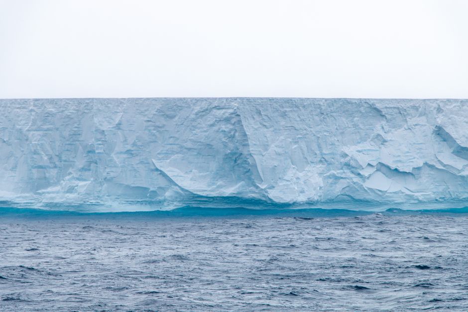 Stunning iceberg in Antarctica showcasing pristine ice formations above the ocean.