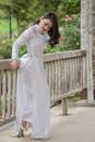Elegant Woman in Traditional White Dress Outdoors