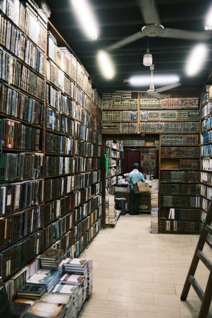 Explore a classic bookshop in Cairo, Egypt, showcasing endless shelves of books and vintage charm.