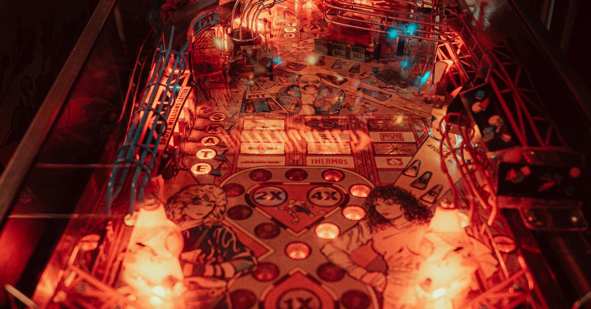 Classic Pinball Machine in Arcadian Ambience · Free Stock Photo