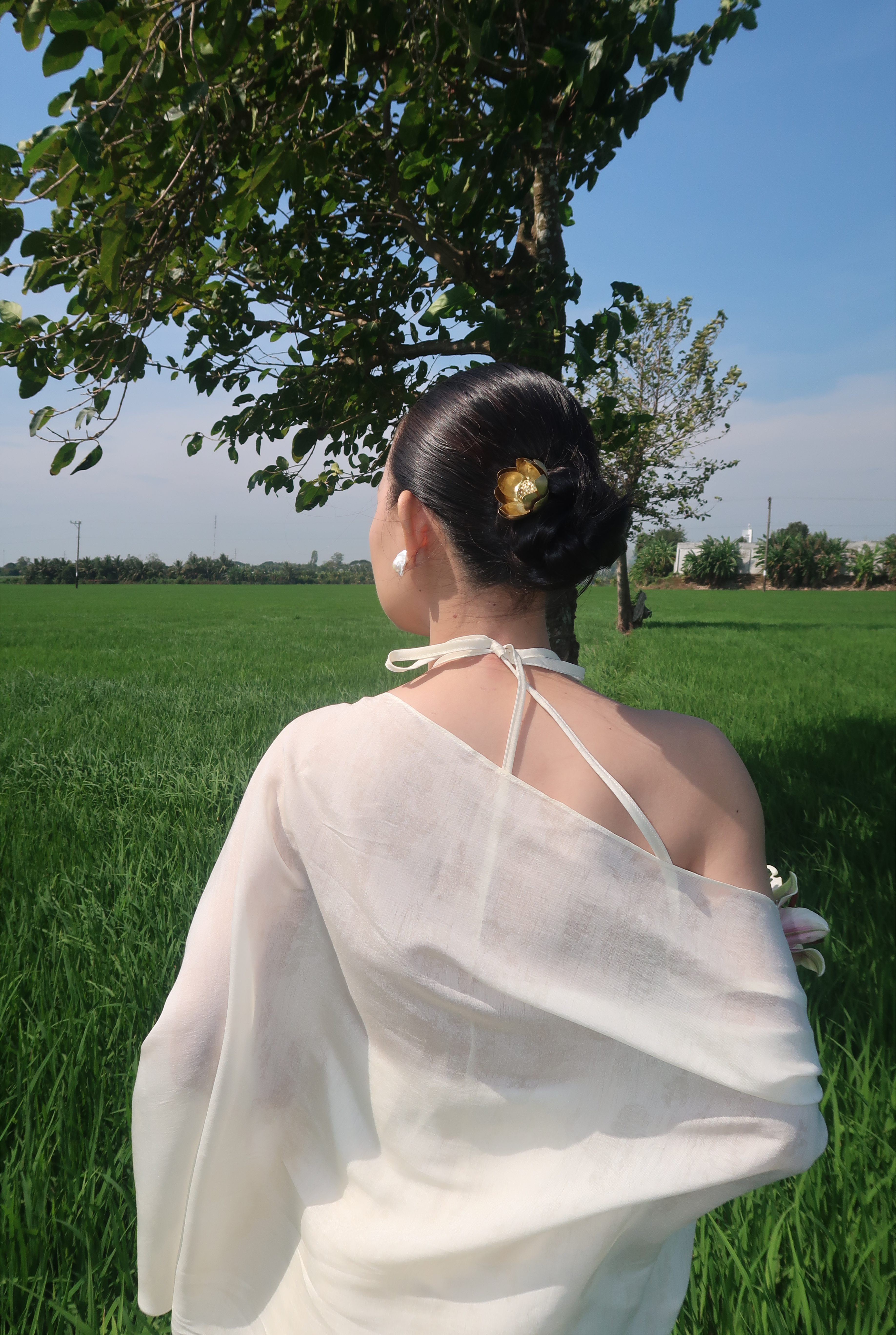 Woman in White Dress Overlooking Green Field · Free Stock Photo