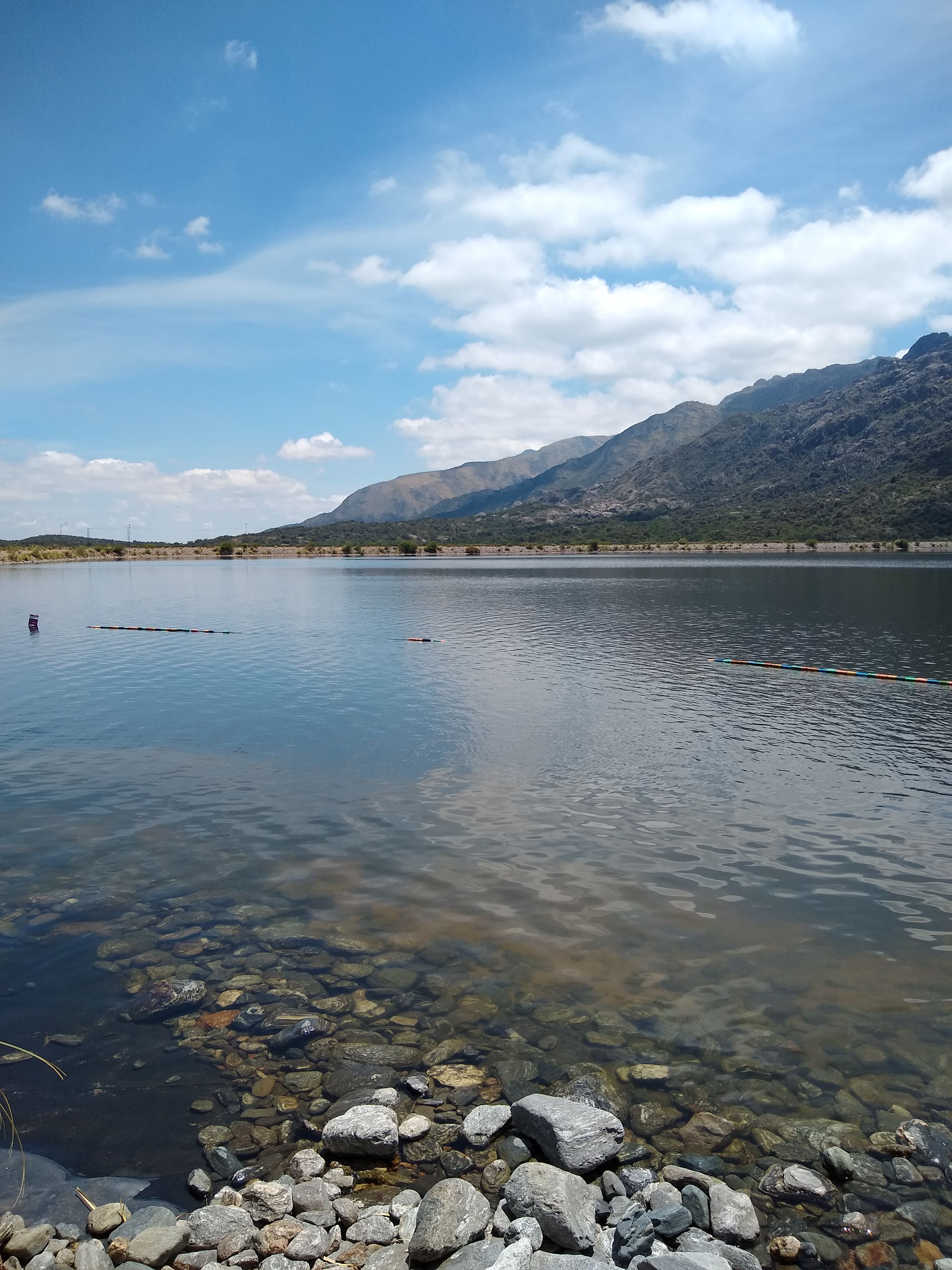 Scenic Mountain Lake View with Rocky Shoreline · Free Stock Photo