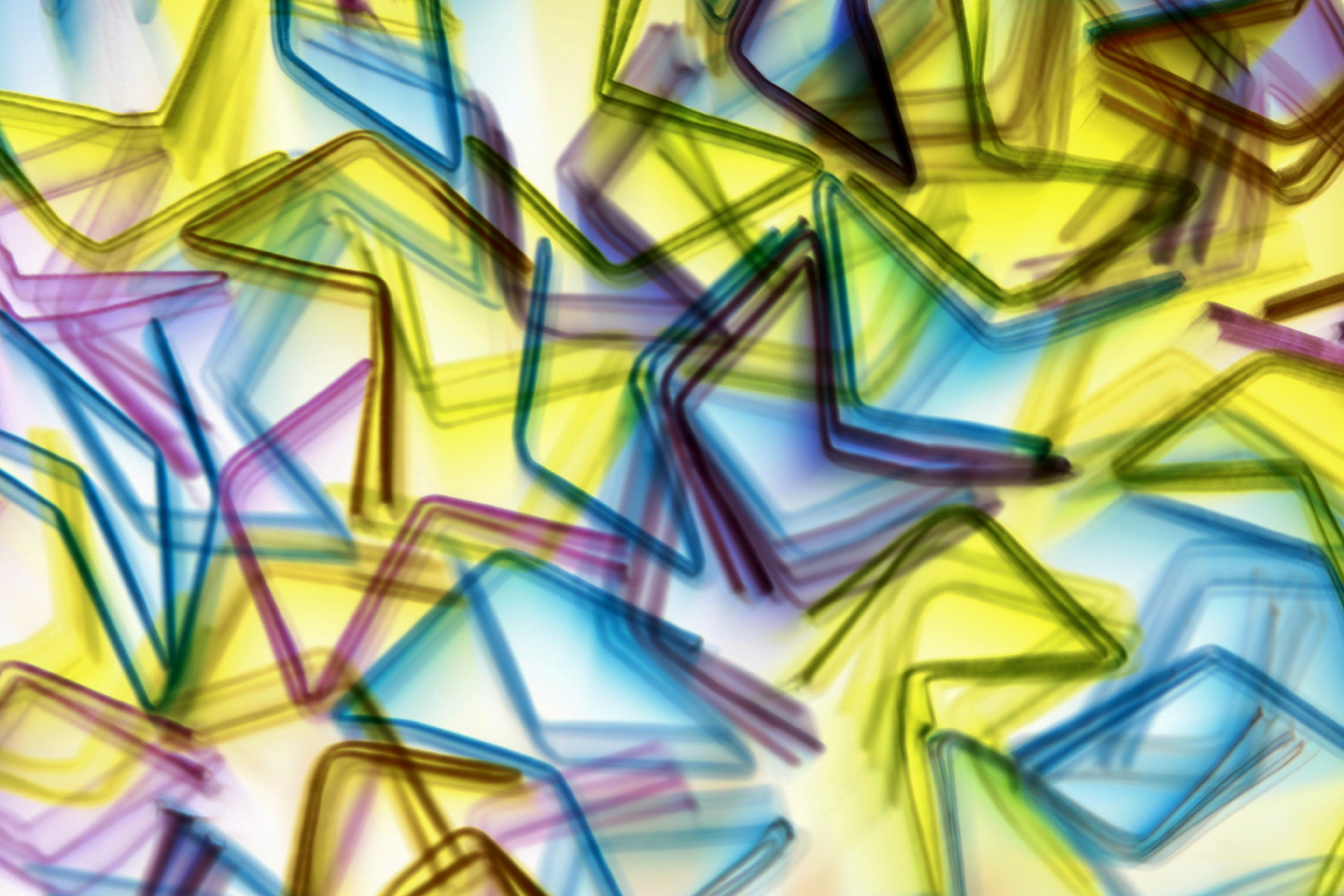 Dynamic abstract art with colorful arrow shapes and motion blur effect.