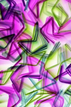 Colorful abstract artwork featuring overlapping star shapes in vibrant hues, creating a dynamic visual effect.