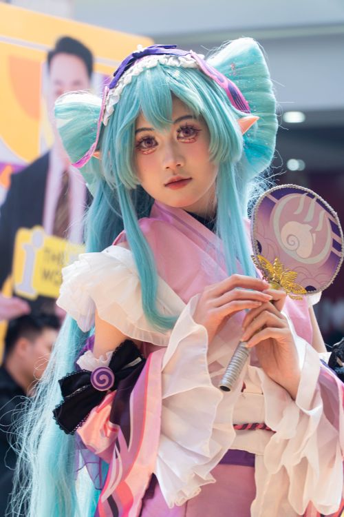 Free Colorful cosplay costume capturing anime character inspired look indoors, vibrant and artistic. Stock Photo