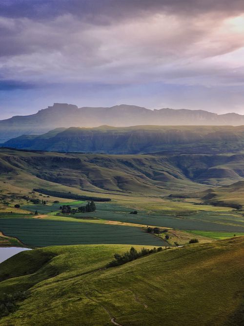 Free Breathtaking view of the Drakensberg Mountains at sunrise, showcasing nature's beauty and vibrant landscapes. Stock Photo