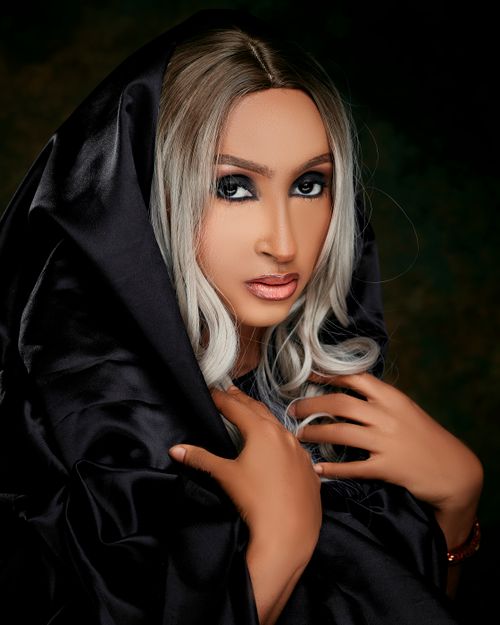 Free Striking portrait of a woman with silver hair draped in a black veil, exuding elegance. Stock Photo