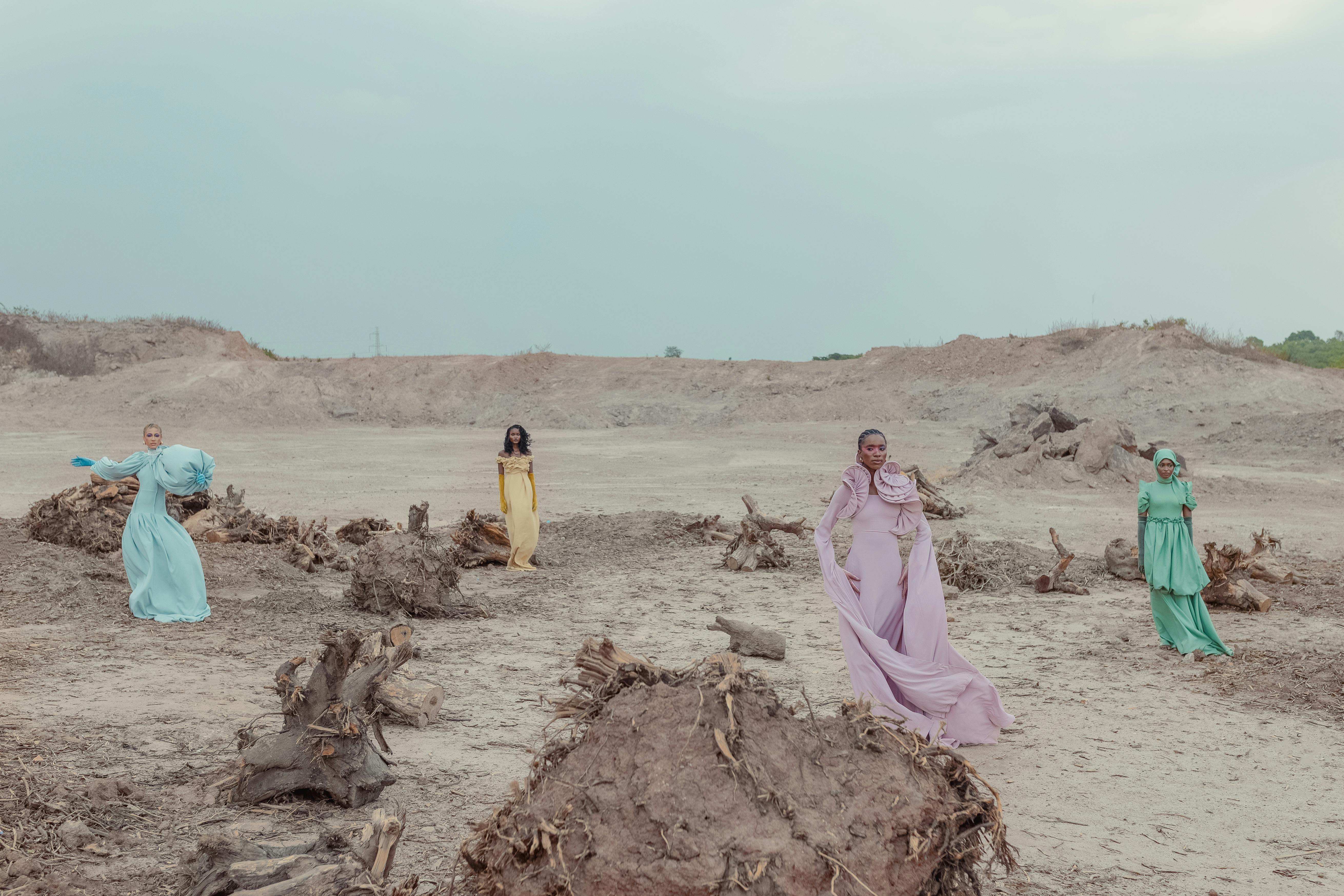 Colorful fashion captured in a rugged, dry landscape, showcasing different styles and elegance.