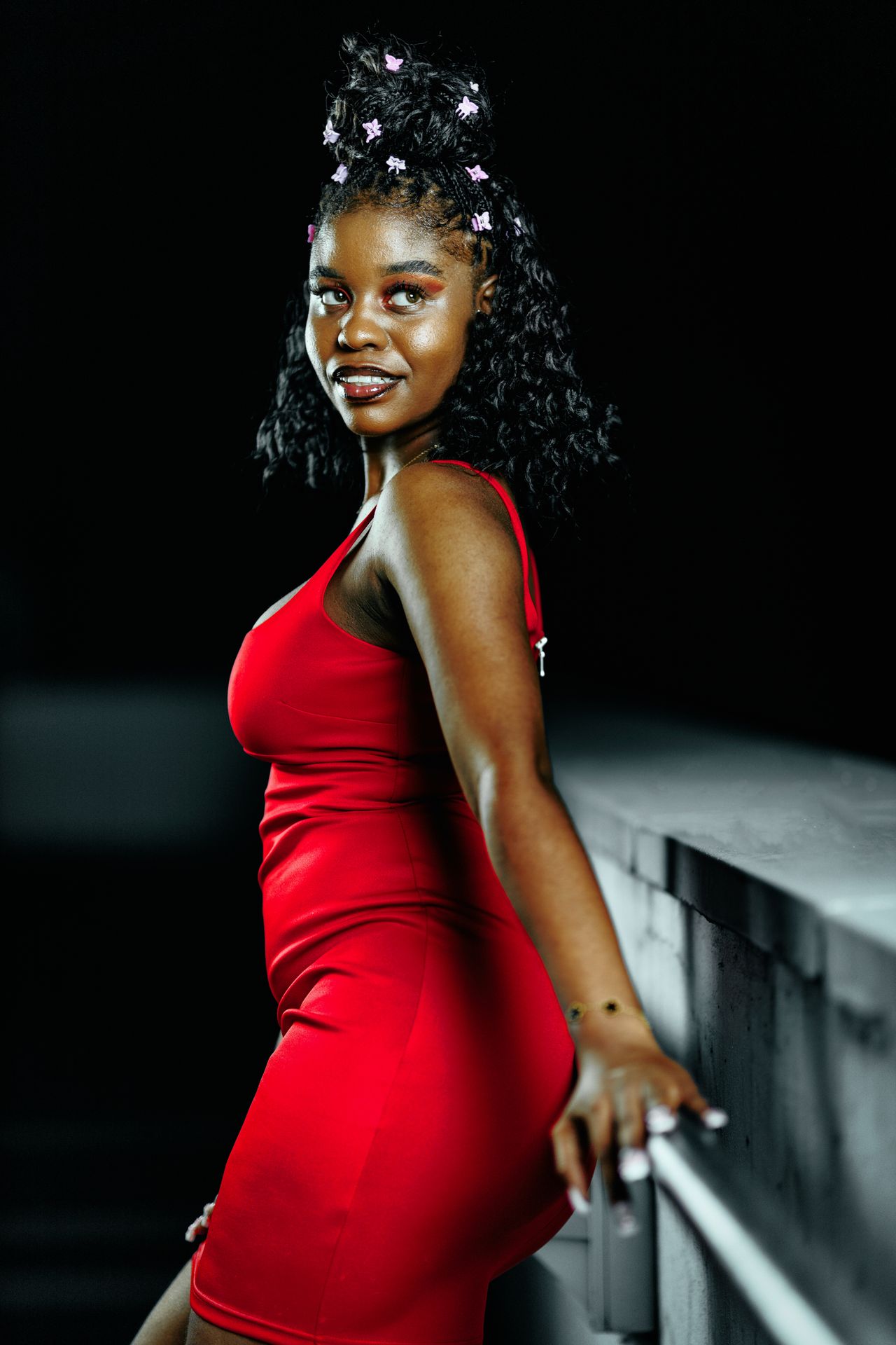 Woman in a red bodycon mini dress at night, a fun red dress outfit for a night out with friends