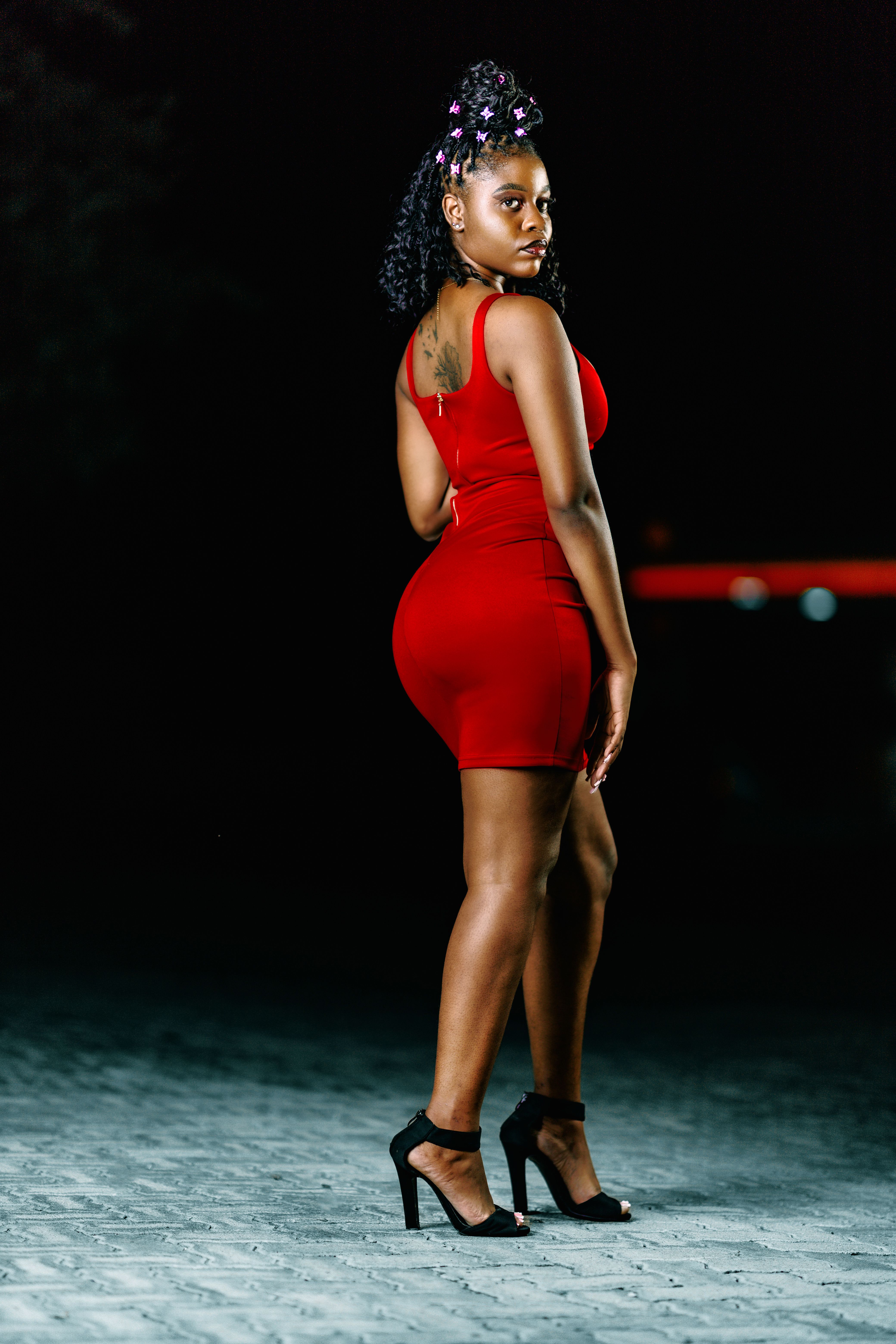 Elegant Woman in Red Dress at Night · Free Stock Photo