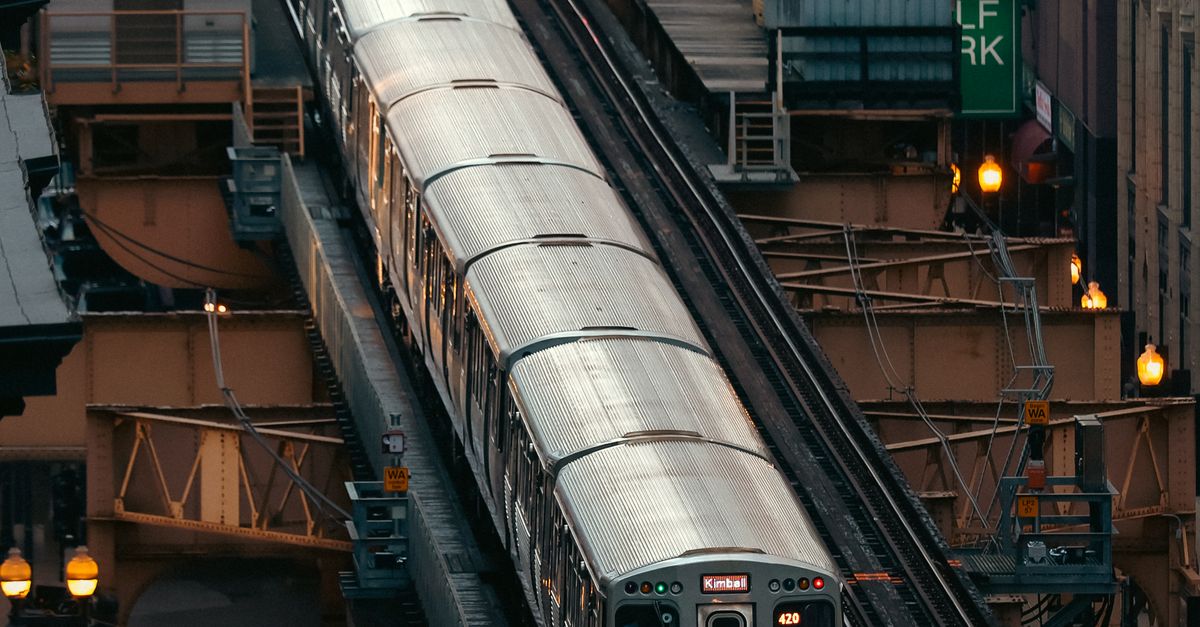 Urban Setting Train Elevated Train in Bustling Urban Cityscape · Free Stock Photo