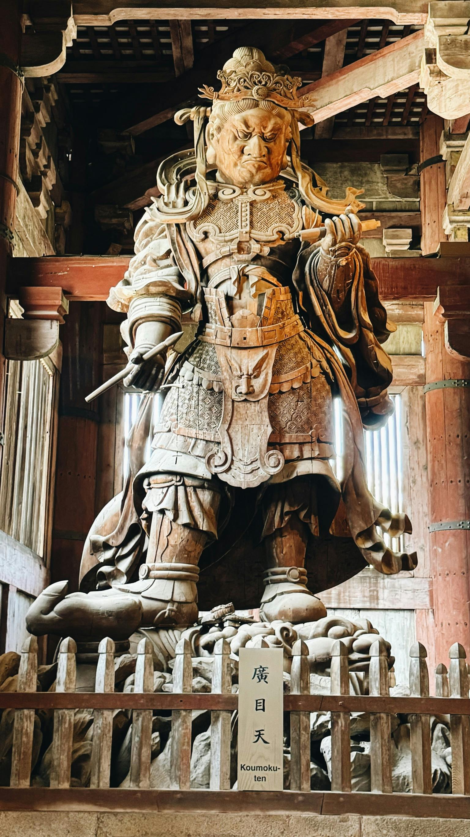 Majestic wooden statue of Koumoku-ten at Todai-ji Temple in Nara, Japan.