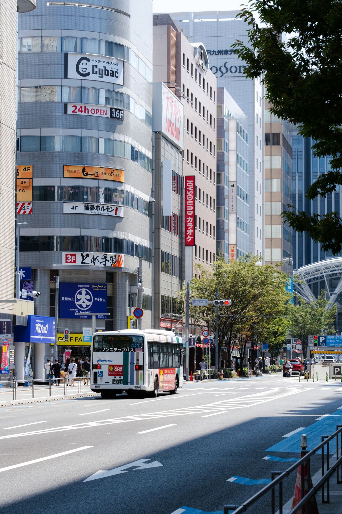 Bustling street scene in Fukuoka Japan — the city's compact urban core on a working day