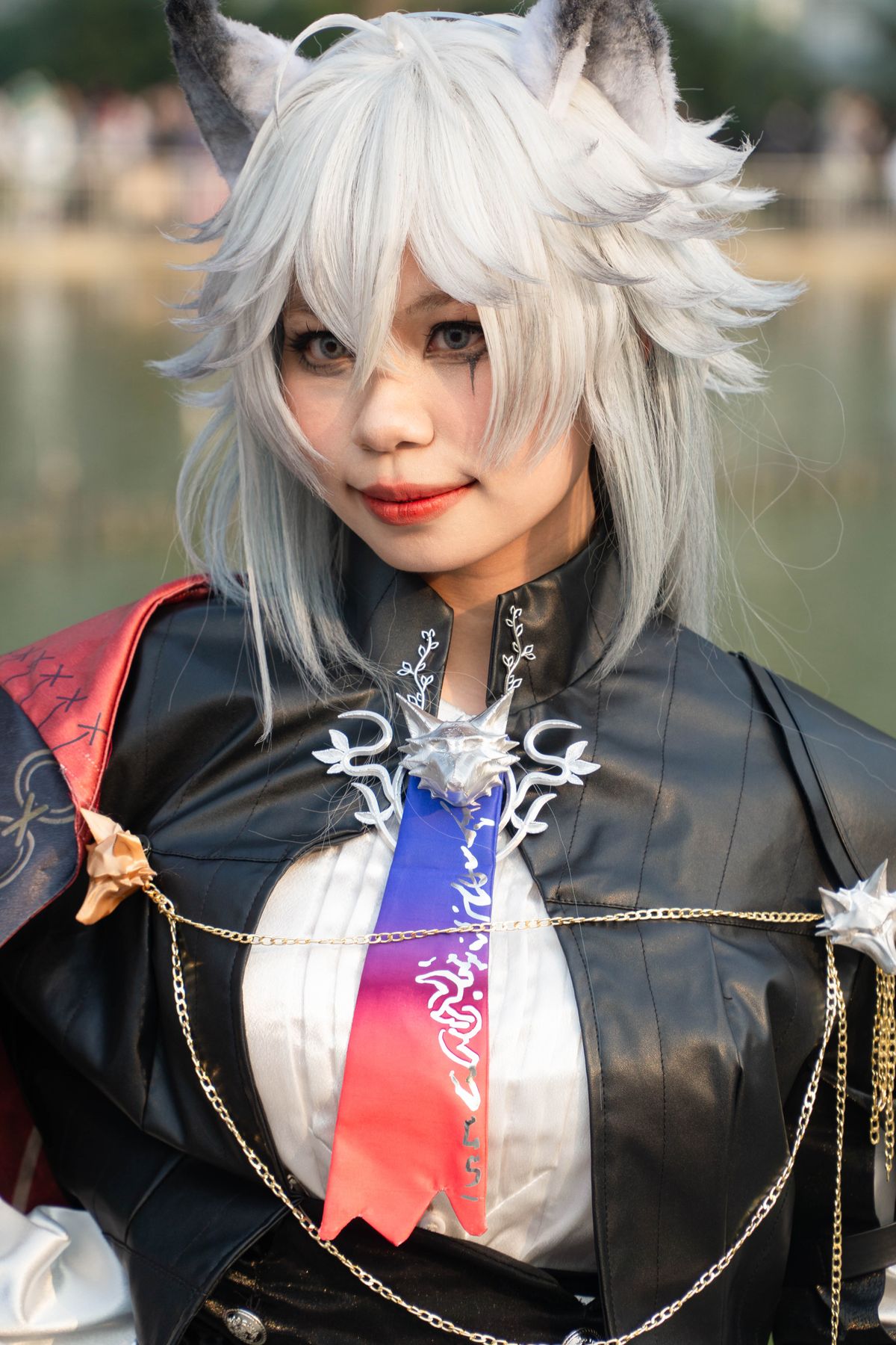 Fantasy cosplayer with white hair and animal ears in elaborate costume