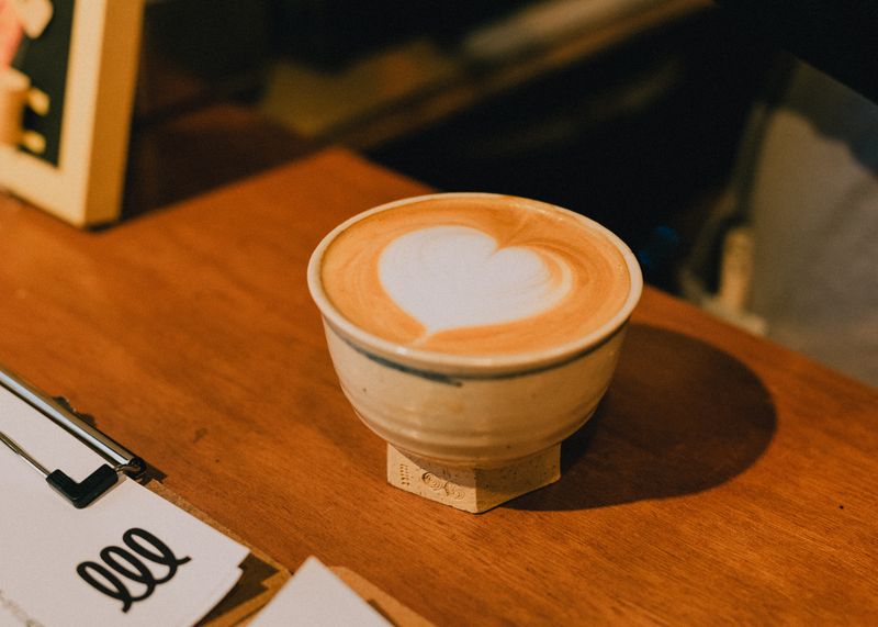 Close-up of latte art in a ceramic cup at Grounded Coffee Co.
