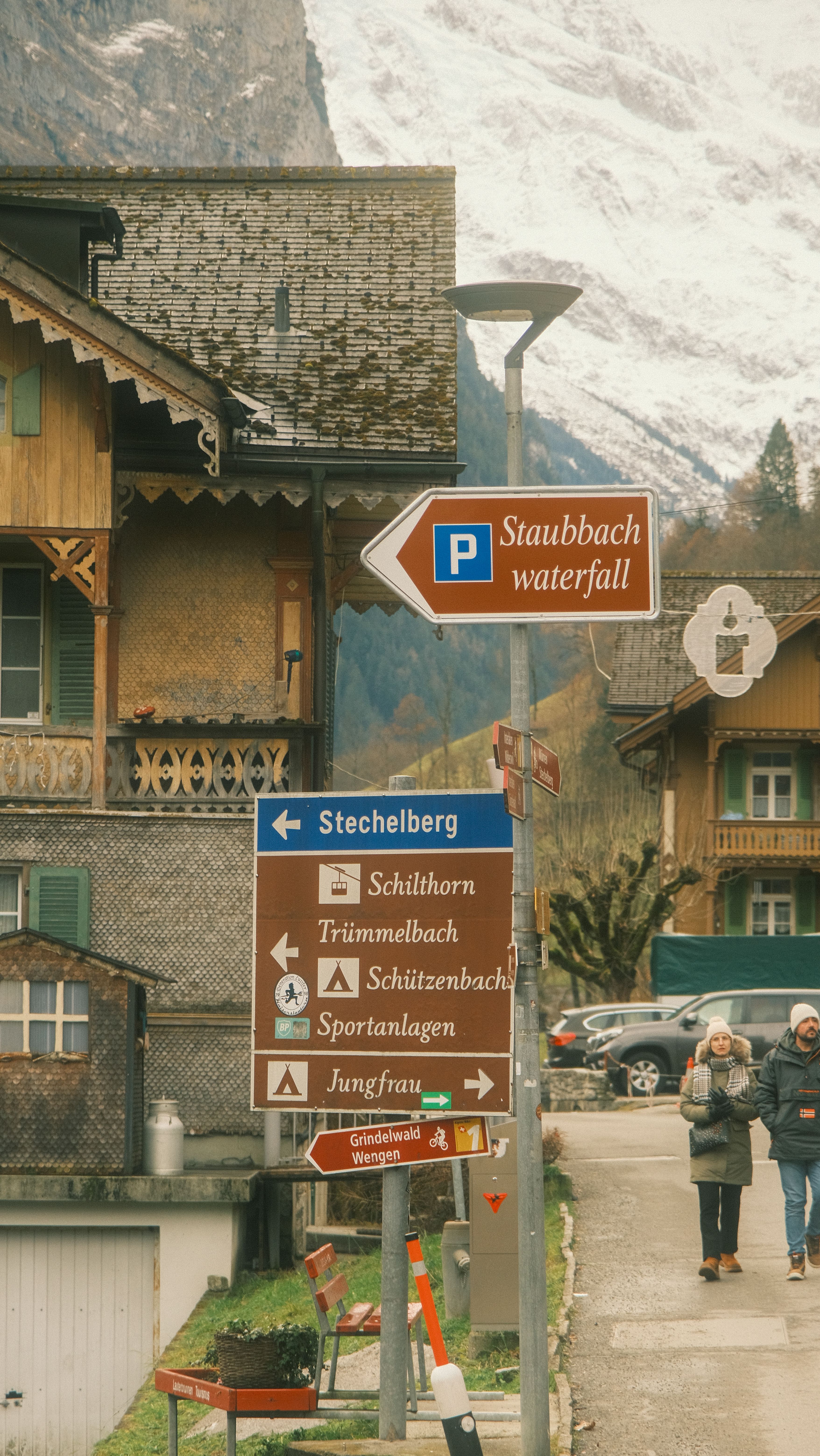 Alpine Village with Directional Signs in Winter · Free Stock Photo