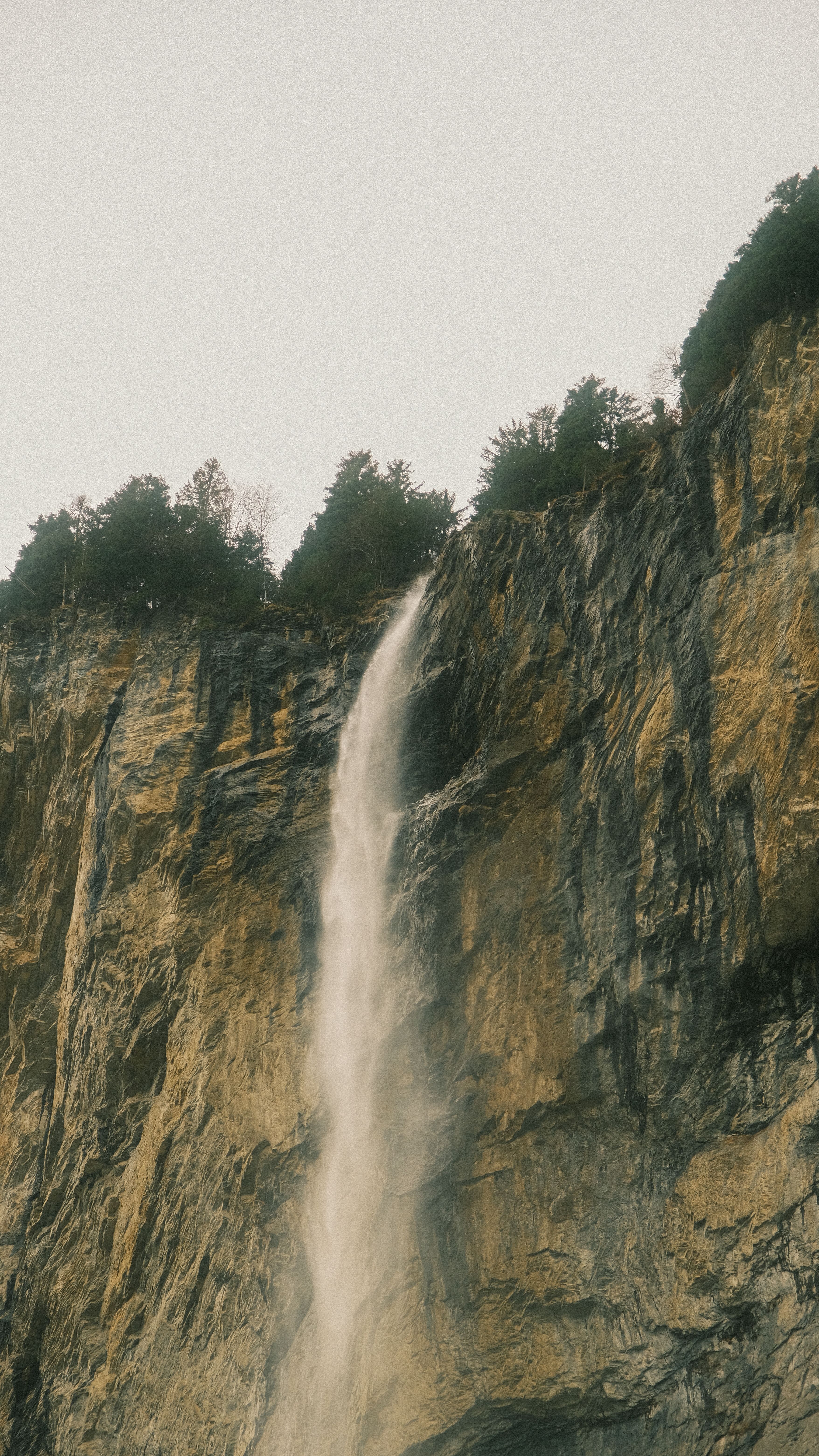 Majestic Waterfall Cascading Down Rocky Cliff · Free Stock Photo