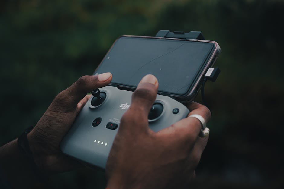 drone pilot with smartphone showing insurance app - Drone liability insurance cost