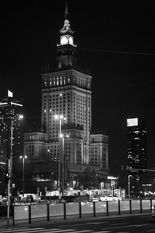 Free Black and white night view of Warsaw's iconic Palace of Culture and Science. Stock Photo