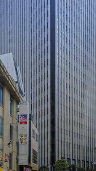 Impressive skyscraper dominating the Tokyo cityscape on a clear day.