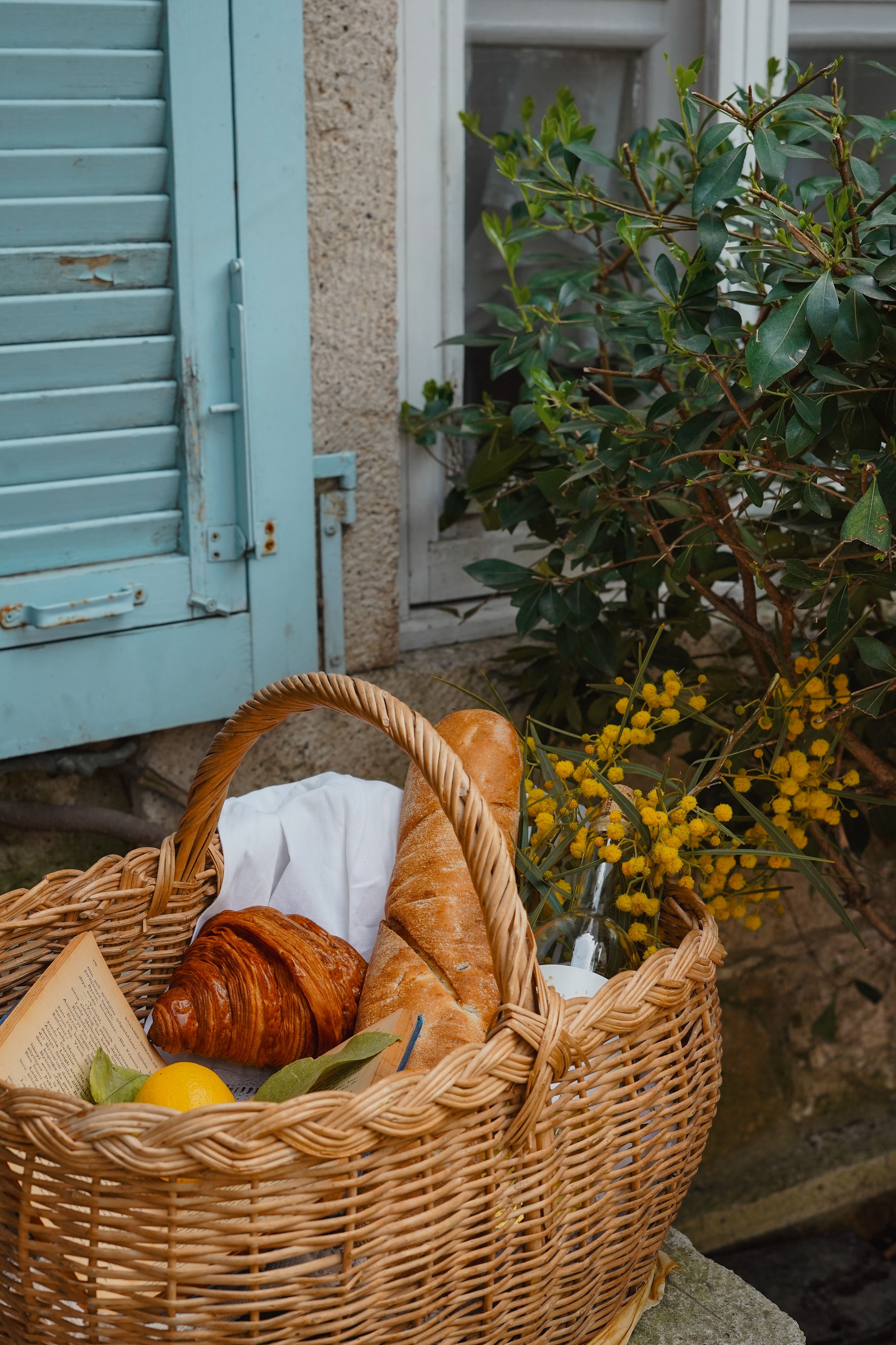 croissants and baguettes in basket