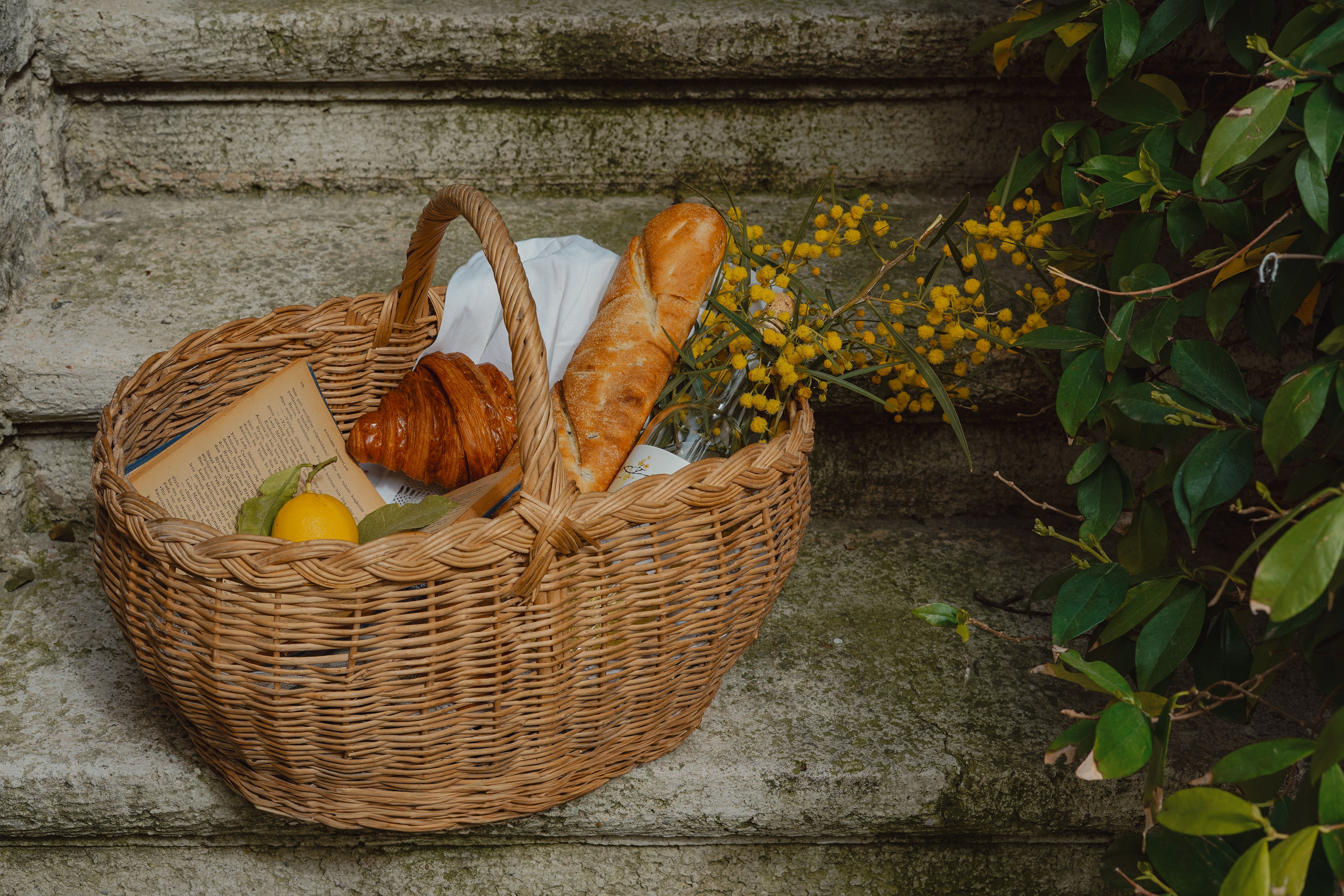 Rustic Picnic Basket with Bread and Flowers · Free Stock Photo