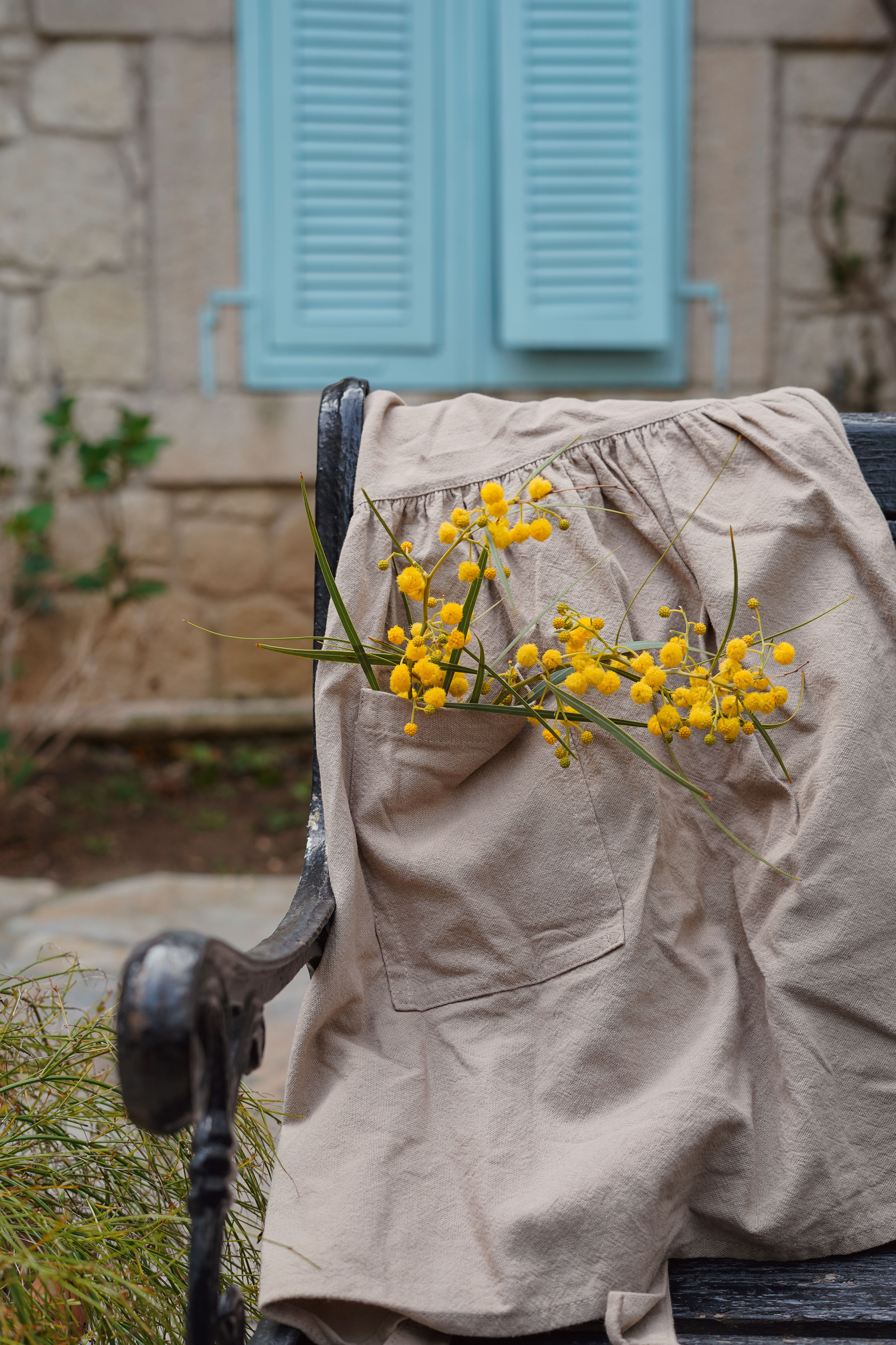 Rustic Bench with Yellow Flowers and Vintage Window · Free Stock Photo